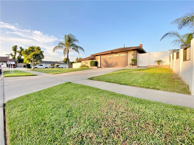 743 N Beechwood Ave, Rialto, CA 92376 - view of front facade featuring concrete driveway, an attached garage, and stucco siding