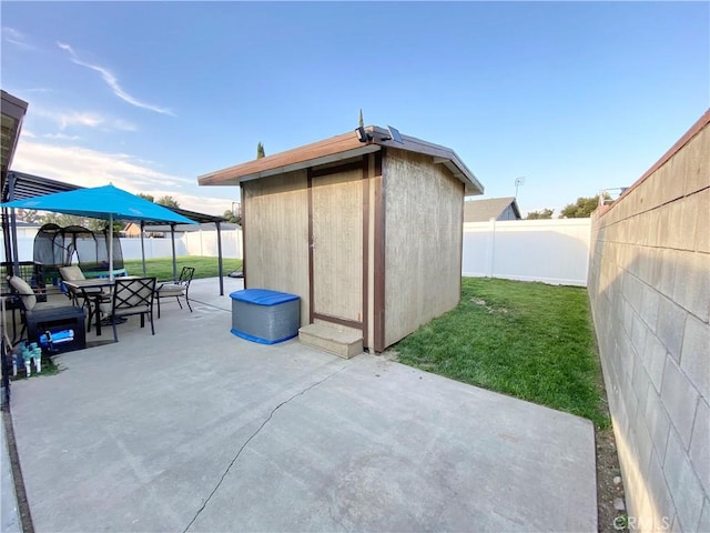 743 N Beechwood Ave, Rialto, CA 92376 - view of shed featuring a fenced backyard and outdoor dining area