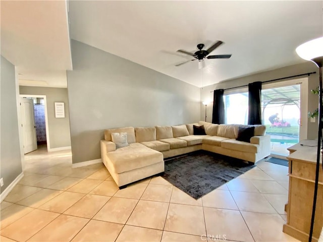 743 N Beechwood Ave, Rialto, CA 92376 - living area featuring light tile patterned floors, ceiling fan, and vaulted ceiling