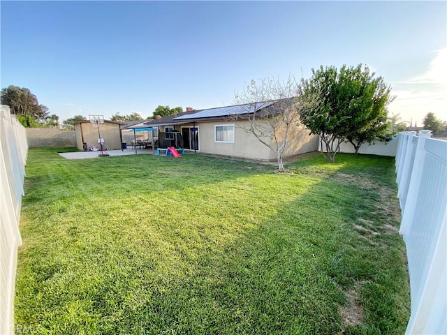 743 N Beechwood Ave, Rialto, CA 92376 - fenced backyard with a patio