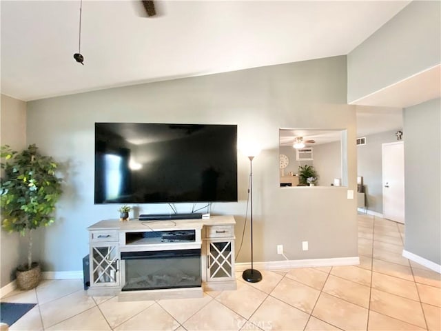 743 N Beechwood Ave, Rialto, CA 92376 - living room featuring light tile patterned floors and lofted ceiling