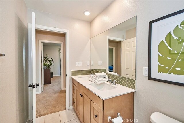 3430 E Foxglove Way, Ontario, CA 91761 - bathroom featuring double vanity, toilet, and tile patterned floors