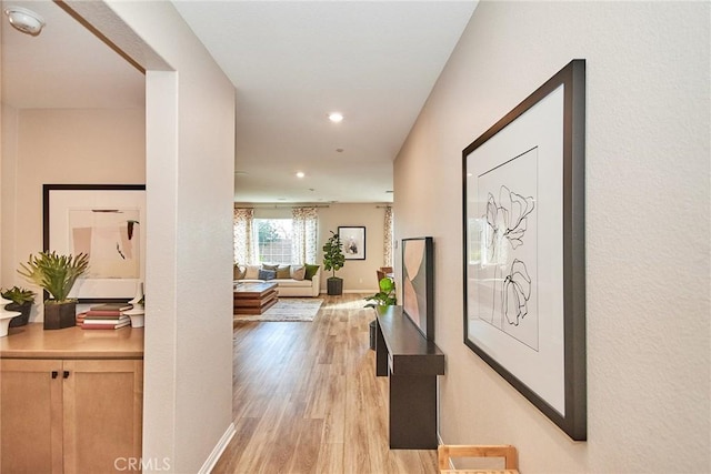 3430 E Foxglove Way, Ontario, CA 91761 - hallway featuring light wood-style floors, recessed lighting, and baseboards