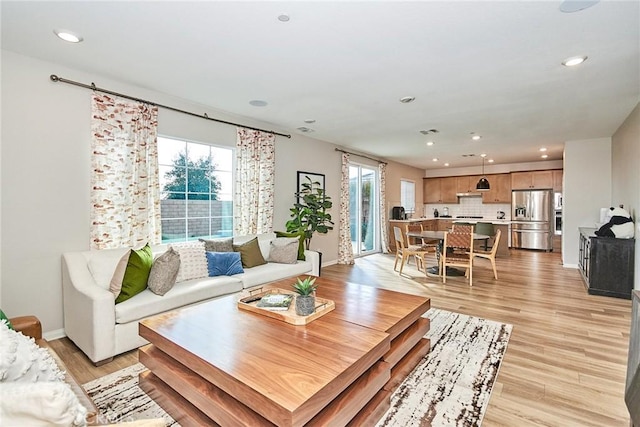 3430 E Foxglove Way, Ontario, CA 91761 - living area featuring recessed lighting, light wood-style floors, and baseboards