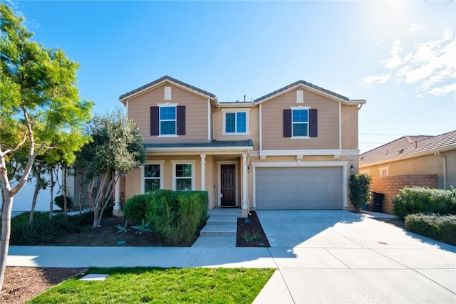 3430 E Foxglove Way, Ontario, CA 91761 - traditional home with a garage, concrete driveway, and stucco siding