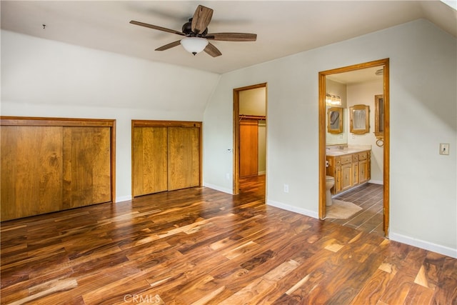 6429 Cedar Ave, Angelus Oaks, CA 92305 - unfurnished bedroom with lofted ceiling, wood finished floors, multiple closets, connected bathroom, and baseboards