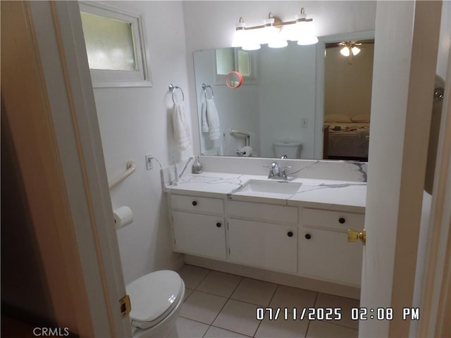 1676 Dumbarton Ave, San Bernardino, CA 92404 - bathroom with tile patterned flooring, vanity, and ceiling fan