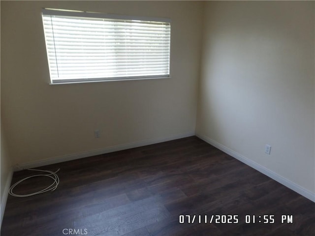 1676 Dumbarton Ave, San Bernardino, CA 92404 - empty room featuring dark wood-style flooring and baseboards