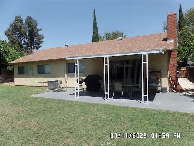1676 Dumbarton Ave, San Bernardino, CA 92404 - back of property featuring a patio, stucco siding, roof with shingles, and a chimney
