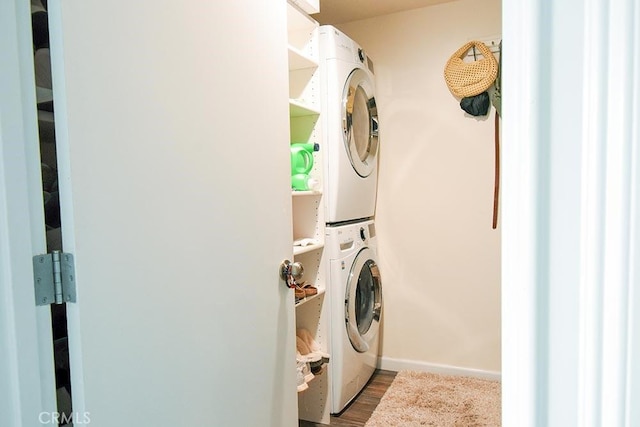 188 Temple Ave Unit 201, Long Beach, CA 90803 - washroom with stacked washer / dryer, dark wood-type flooring, and baseboards