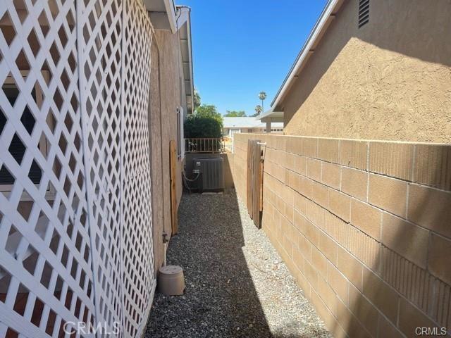 900 Raquel Ct, Hemet, CA 92545 - view of property exterior featuring central air condition unit and stucco siding