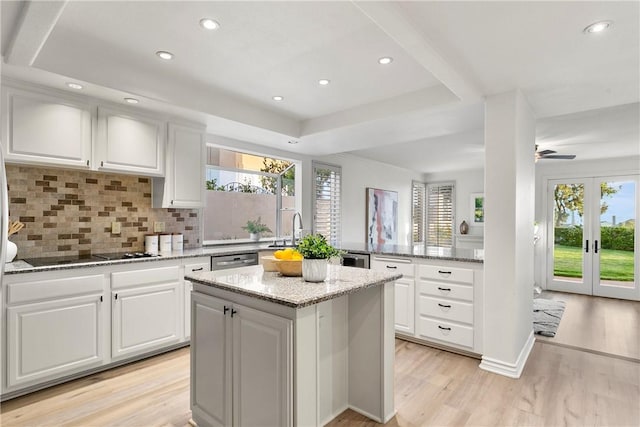 11 Porto Cervo Dr, Dana Point, CA 92629 - kitchen with black electric cooktop, plenty of natural light, light wood-type flooring, a kitchen island, and recessed lighting
