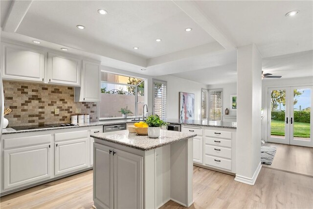 11 Porto Cervo Dr, Dana Point, CA 92629 - kitchen with black electric cooktop, plenty of natural light, light wood-type flooring, a kitchen island, and recessed lighting