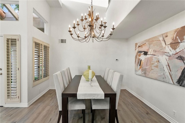 11 Porto Cervo Dr, Dana Point, CA 92629 - dining area featuring wood finished floors and a chandelier