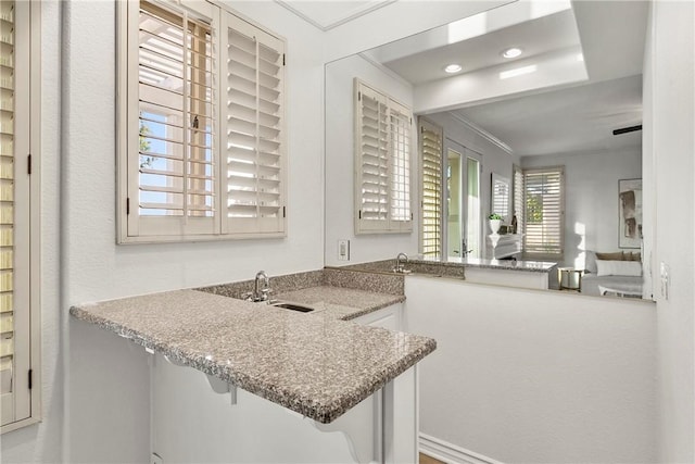 11 Porto Cervo Dr, Dana Point, CA 92629 - kitchen featuring ornamental molding, a peninsula, a kitchen breakfast bar, and recessed lighting