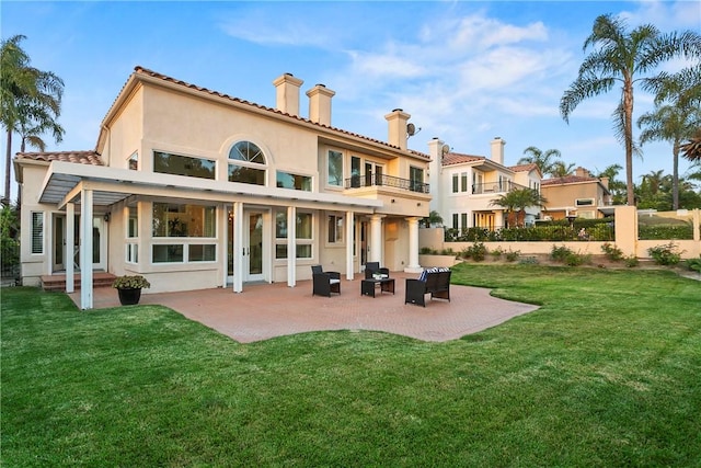 11 Porto Cervo Dr, Dana Point, CA 92629 - rear view of property with a balcony, stucco siding, a chimney, a patio, and an outdoor hangout area