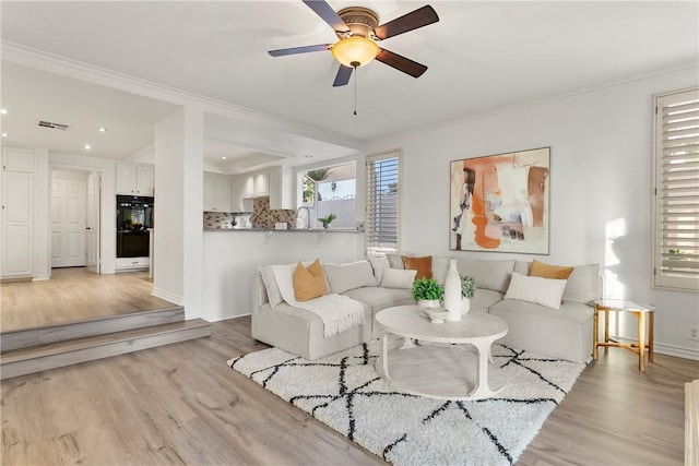 11 Porto Cervo Dr, Dana Point, CA 92629 - living area featuring ornamental molding, light wood-type flooring, a ceiling fan, and recessed lighting