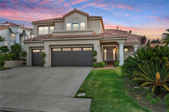 11 Porto Cervo Dr, Dana Point, CA 92629 - mediterranean / spanish home featuring driveway, a front lawn, an attached garage, stucco siding, and a tile roof
