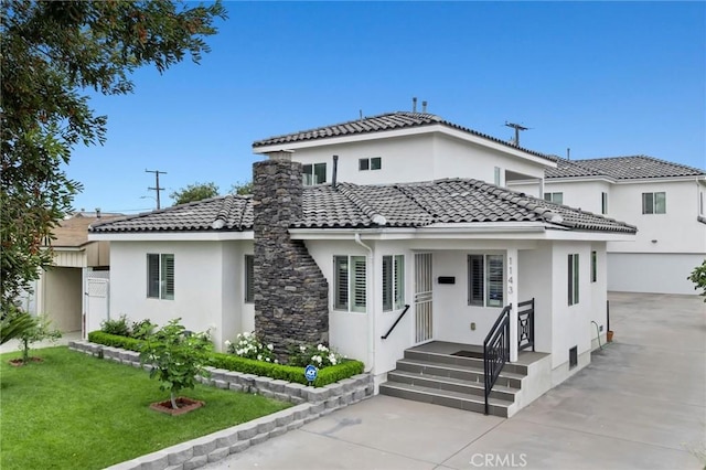 1143 W 163rd St, Gardena, CA 90247 - view of front facade featuring stucco siding, a tile roof, a front yard, and concrete driveway