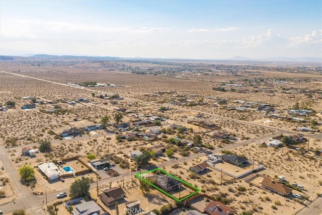 7415 Saladin Ave Unit 29, Palms, CA 92277 - aerial view of sparsely populated area featuring a desert landscape, property boundaries highlighted, and mountains