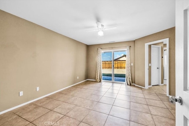 7415 Saladin Ave Unit 29, Palms, CA 92277 - spare room with a ceiling fan, light tile patterned floors, and baseboards