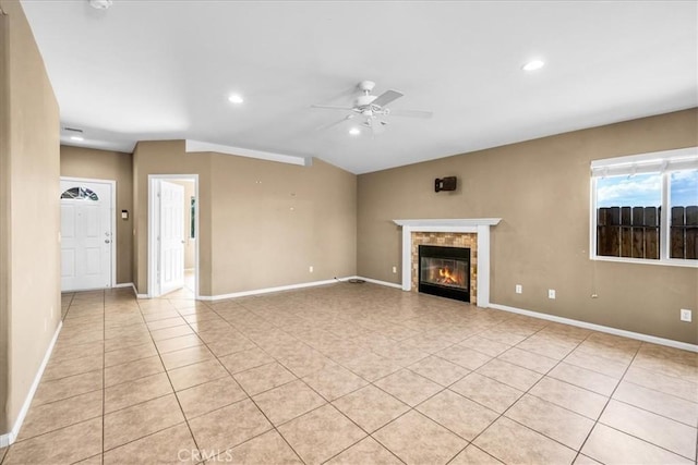 7415 Saladin Ave Unit 29, Palms, CA 92277 - unfurnished living room featuring a ceiling fan, light tile patterned floors, a tile fireplace, baseboards, and recessed lighting