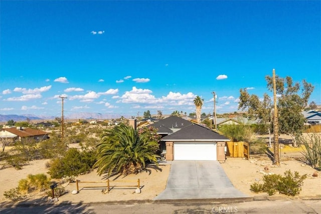 7415 Saladin Ave Unit 29, Palms, CA 92277 - ranch-style house featuring an attached garage, driveway, and a mountain view