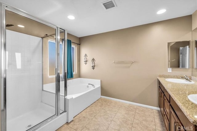 7415 Saladin Ave Unit 29, Palms, CA 92277 - full bathroom with a stall shower, a bath, double vanity, baseboards, and tile patterned flooring