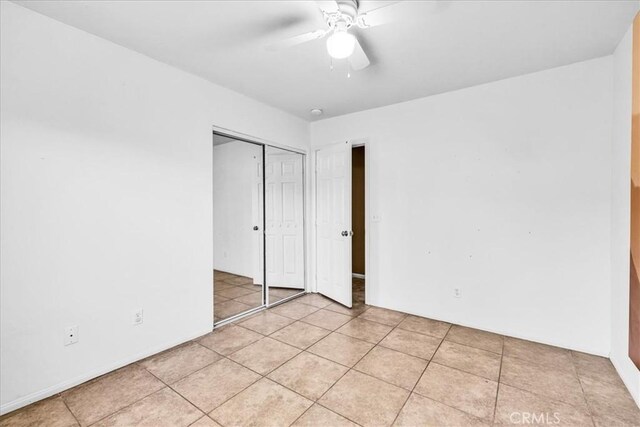 7415 Saladin Ave Unit 29, Palms, CA 92277 - unfurnished bedroom with a closet, light tile patterned floors, and ceiling fan