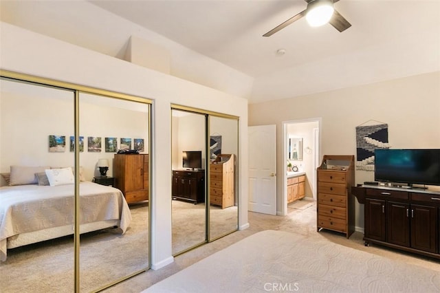 430 Rainier Rd, Lake Arrowhead, CA 92352 - bedroom featuring multiple closets, light colored carpet, connected bathroom, lofted ceiling, and a ceiling fan