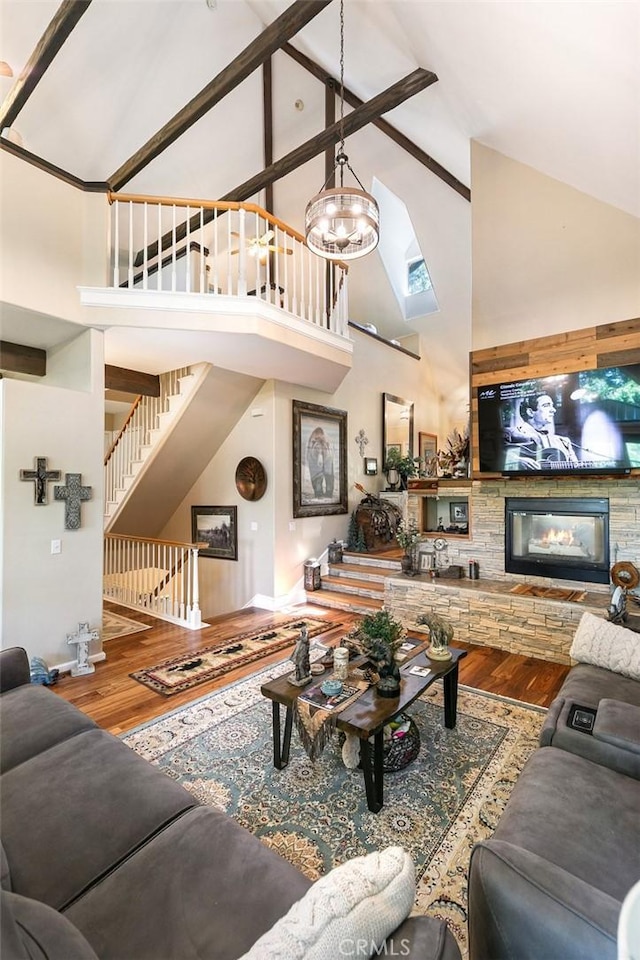 430 Rainier Rd, Lake Arrowhead, CA 92352 - living area featuring high vaulted ceiling, wood finished floors, stairway, baseboards, and a chandelier