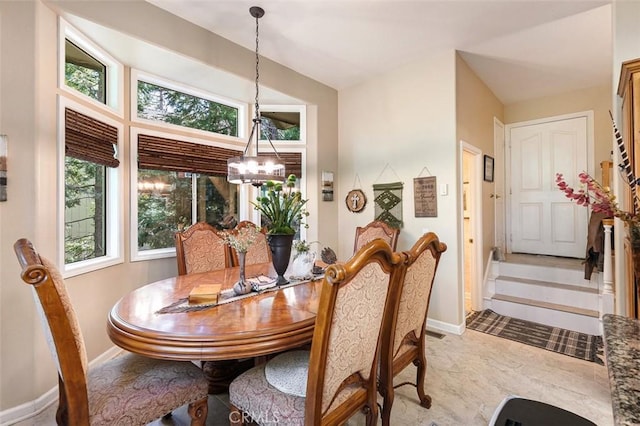 430 Rainier Rd, Lake Arrowhead, CA 92352 - dining space featuring a chandelier, plenty of natural light, and baseboards