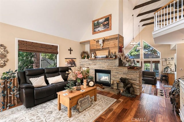 430 Rainier Rd, Lake Arrowhead, CA 92352 - living area featuring high vaulted ceiling, a stone fireplace, and wood finished floors