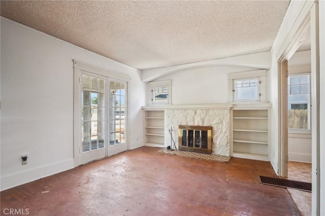 542 Ojai Rd, Santa Paula, CA 93060 - unfurnished living room featuring a textured ceiling and a fireplace with flush hearth