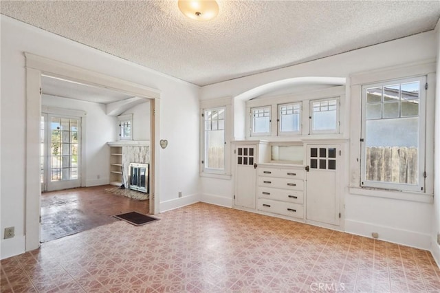 542 Ojai Rd, Santa Paula, CA 93060 - foyer entrance featuring tile patterned floors, a textured ceiling, and a high end fireplace