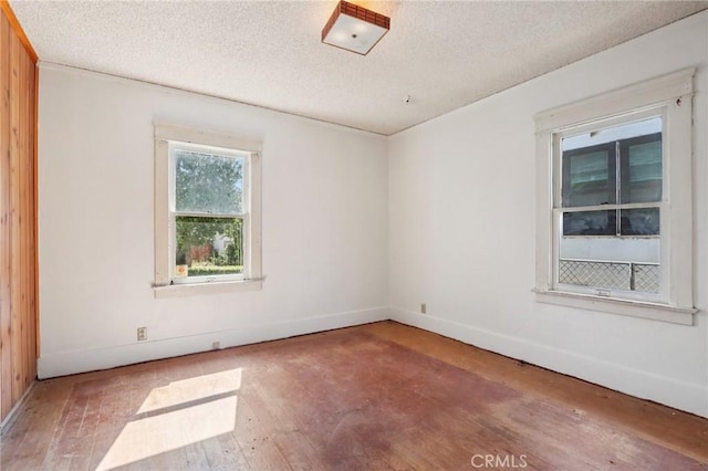 542 Ojai Rd, Santa Paula, CA 93060 - empty room featuring hardwood / wood-style floors and a textured ceiling