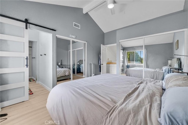 2940 Cherry Way, Ontario, CA 91761 - bedroom with wood finished floors, a ceiling fan, two closets, and a barn door