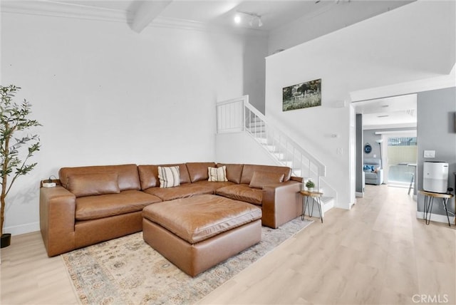 2940 Cherry Way, Ontario, CA 91761 - living area featuring stairway, light wood-style flooring, track lighting, baseboards, and ornamental molding