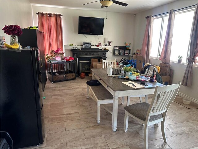 1538 Regents St, Lancaster, CA 93534 - dining room with ceiling fan and baseboards