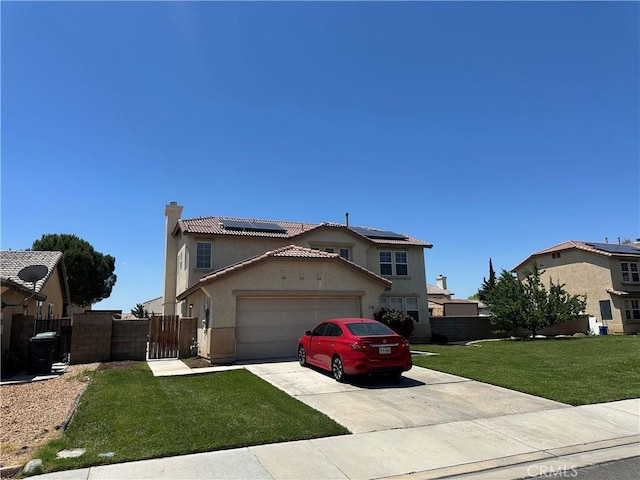 1538 Regents St, Lancaster, CA 93534 - view of front of house with roof mounted solar panels, stucco siding, a garage, driveway, and a chimney