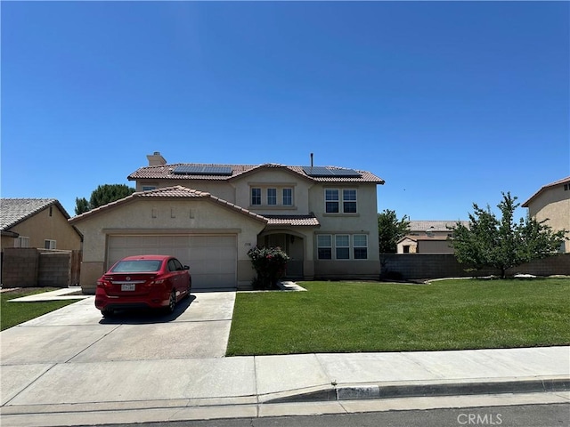 1538 Regents St, Lancaster, CA 93534 - mediterranean / spanish house featuring driveway, stucco siding, an attached garage, roof mounted solar panels, and a chimney