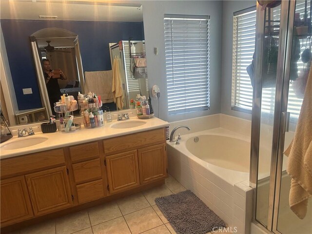 1538 Regents St, Lancaster, CA 93534 - bathroom with a garden tub, tile patterned floors, double vanity, and a stall shower