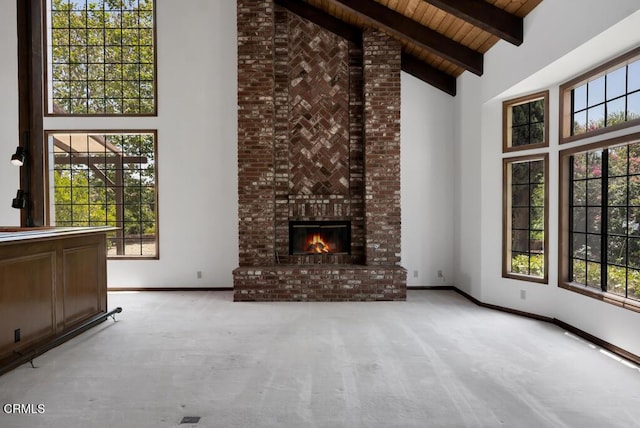 11395 Highridge Ct, Camarillo, CA 93012 - unfurnished living room featuring high vaulted ceiling, carpet floors, healthy amount of natural light, a brick fireplace, and a wooden ceiling with exposed beams