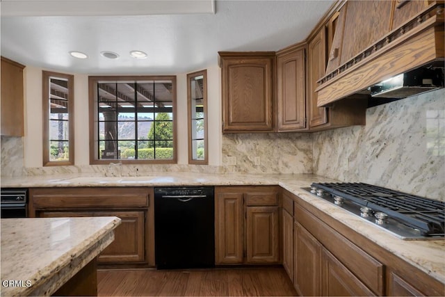 11395 Highridge Ct, Camarillo, CA 93012 - kitchen with black dishwasher, stainless steel gas stovetop, premium range hood, decorative backsplash, and wood finished floors