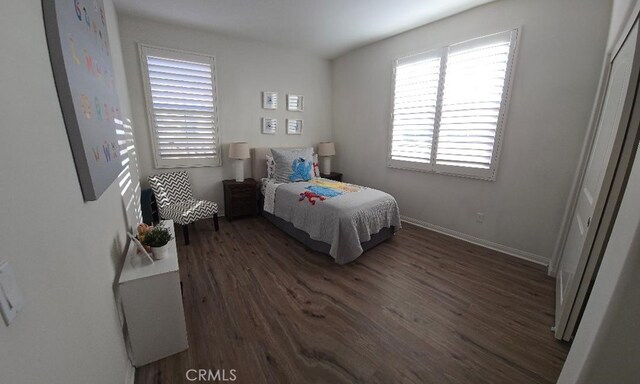 14332 Hibiscus Ct, Westminster, CA 92683 - bedroom with dark wood finished floors and baseboards