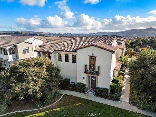 2 Jaripol Cir, Rancho Mission Viejo, CA 92694 - mediterranean / spanish-style house featuring a tiled roof, a balcony, stucco siding, and a mountain view