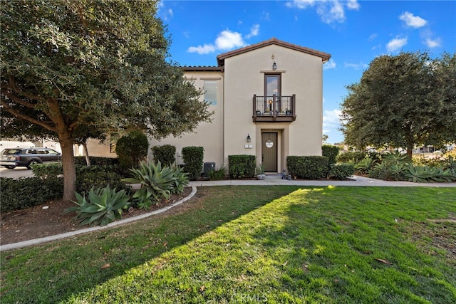 2 Jaripol Cir, Rancho Mission Viejo, CA 92694 - mediterranean / spanish home featuring a balcony, a front yard, stucco siding, and a tile roof