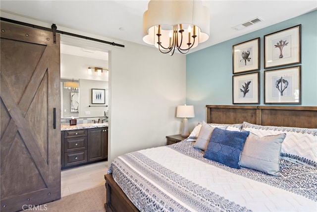 2 Jaripol Cir, Rancho Mission Viejo, CA 92694 - bedroom with a barn door, ensuite bath, and a chandelier