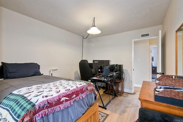 1651 S Juniper St Unit 106, Escondido, CA 92025 - bedroom with light wood finished floors, a desk, and baseboards