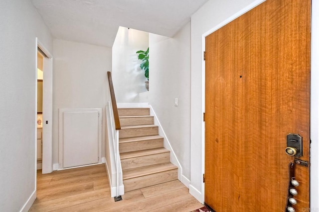 1651 S Juniper St Unit 106, Escondido, CA 92025 - staircase with wood finished floors and baseboards